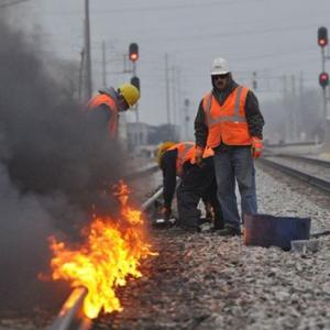 It's so cold in Chicago they're lighting train tracks on fire