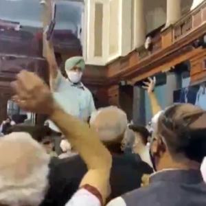 Opposition MPs climb on table, throw papers in RS