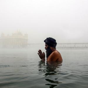Golden Temple Wrapped In Fog