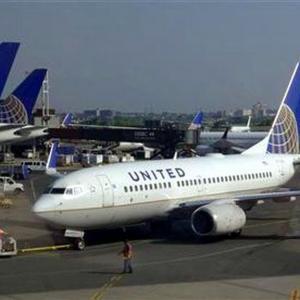Man opens plane emergency exit, walks on wing in US