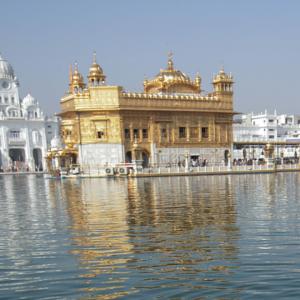 Woman with tiranga on cheek stopped at Golden Temple