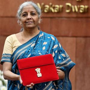 Tablet in red pouch, FM presents 3rd paperless Budget