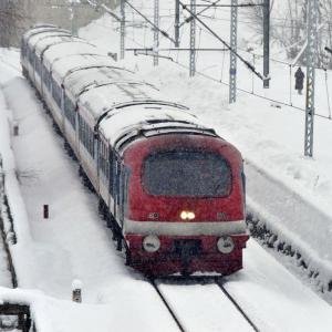 A Train Chugs Along In The Kashmir Snow