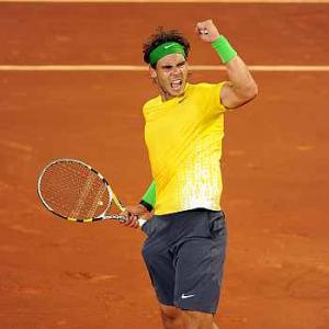 Nadal fights back to beat Federer in Madrid
