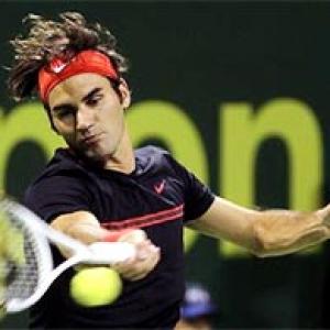 Federer and Nadal ease into Qatar quarter-finals