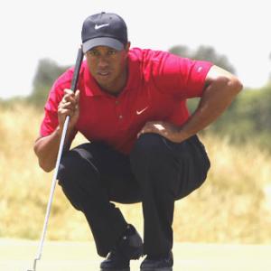 Woods shares lead with Britain's Rock