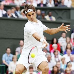 PHOTOS: Federer enters 8th Wimbledon final