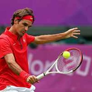 Federer survives first round scare