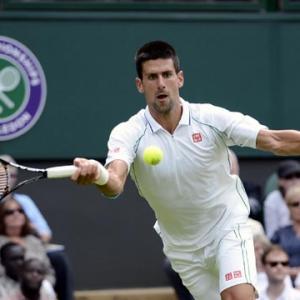 PHOTOS: Djokovic cruises, Venus knocked out