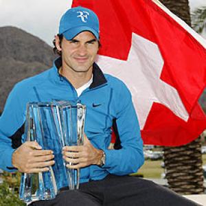 Cool Federer downs Isner to win Indian Wells title