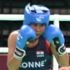 Sarita stuns world champ in quest for Olympic berth