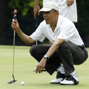 In a first, Obama playing golf with Tiger Woods