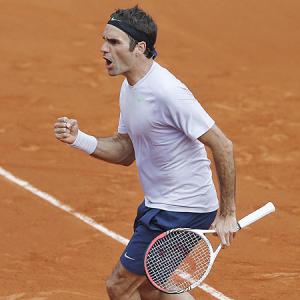 Milestone man Federer completes the quartet