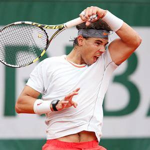 French Open PHOTOS: Nadal wobbles, Federer dances