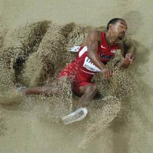 PHOTOS: Taylor wins triple jump gold with second-longest ever leap