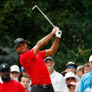 Woods turns 40, in touching distance to record majors