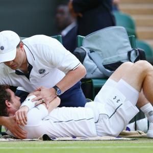 Wimbledon: Massaged Murray bites back to reach last 16