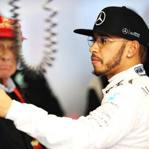 Australian Grand Prix: Hamilton quickest, Rosberg crashes in rain