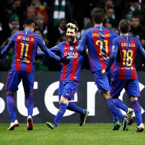 PHOTOS: Messi double lifts Barcelona, Man City advance