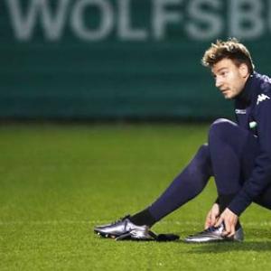 Wenger surprised by Bendtner's move to Forest