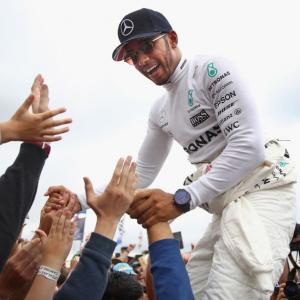 Hamilton marks 200th race with victory in Belgium
