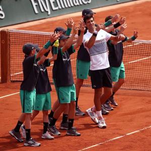 Djokovic makes winning French Open start on Agassi's watch