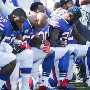 Trump calls for ban on kneeling during anthem
