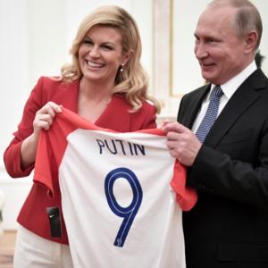 Croatian leader hands Putin soccer shirt before World Cup final