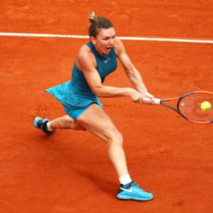 French Open PIX: Halep rallies to advance, Kvitova through