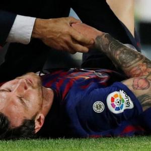 Messi injury blow as Barca go top with win over Sevilla