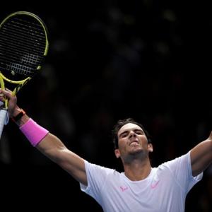 Nadal battles from brink to beat Medvedev