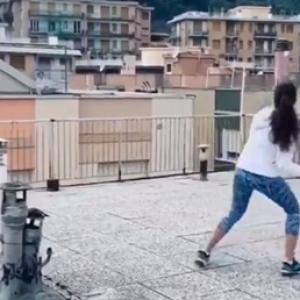 SEE: Italians take to rooftop tennis amid lockdown