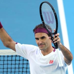 Federer saves seven matchpoints to reach semis