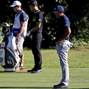 Golf makes subdued return with moment of silence