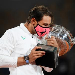 Nadal continues Paris reign with record-equalling Slam