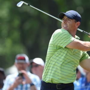 PGA Championship: McIlroy grabs lead as Woods falters