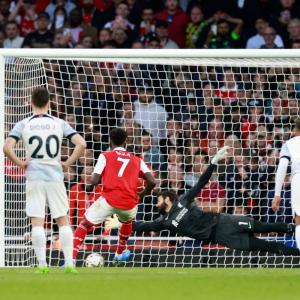 EPL PIX: Arsenal down Reds to go top; Hammers rally