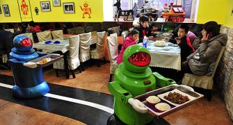 IMAGES: A restaurant where robots cook and serve food