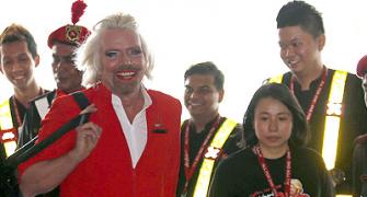 IMAGES: 'Stewardess' Richard Branson fired by AirAsia chief