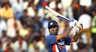 Dhoni's century sets up big win for India