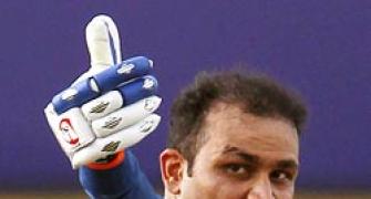 Sehwag's ton helps India storm into final