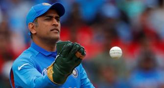 PIX: Dhoni complies with ICC, wears gloves without logo