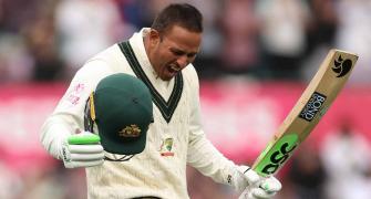 Australia's Khawaja flies to India after visa approved