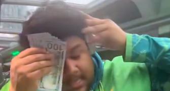 Pakistan cricketer wipes sweat with US dollar note