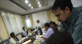 Markets end with modest gains on global cues