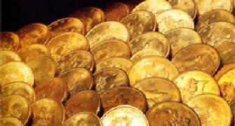 Gold glitters with second biggest gain in 2011; up by Rs 1,025