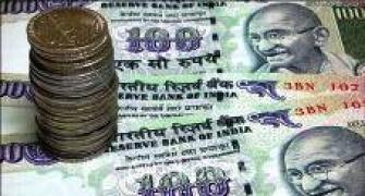 Rupee ends flat at 55.64 vs dollar in volatile trade