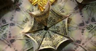 Rupee up by 11 paise against dollar