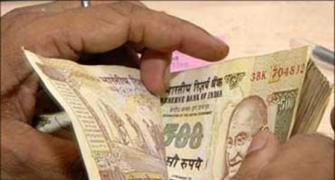 Rupee slips 25 paise to 53.72