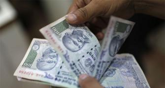 Rupee gains; heavy RBI hand seen